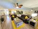 Spacious living room with gray couch and yellow accents at 2225 62Nd N Ave # 3202, St Petersburg, FL 33702