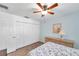 Bedroom with double door closet and ceiling fan at 2661 Peachtree E Cir, Clearwater, FL 33761