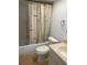 Bathroom with a shower/tub combo and nautical-themed shower curtain at 3259 Hilary Cir # 1A, Palm Harbor, FL 34684