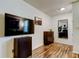 Functional home office with wood floors and built-in shelving at 4527 W La Villa Ln, Tampa, FL 33611