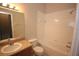 Bathroom with tub, toilet, and granite countertop at 5110 Cactus Needle Ln, Wesley Chapel, FL 33544