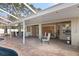 Covered patio overlooks the pool and opens to the interior at 5171 Bone Ln, Brooksville, FL 34604