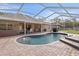 Enjoy this refreshing pool with a screened enclosure at 5171 Bone Ln, Brooksville, FL 34604