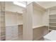 Spacious walk-in closet with shelves and hanging rods at 5171 Bone Ln, Brooksville, FL 34604