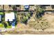 Aerial view showing house and unique garden layout at 6117 E 113Th Ave, Temple Terrace, FL 33617