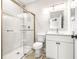 Modern bathroom with white vanity and glass shower at 6117 E 113Th Ave, Temple Terrace, FL 33617