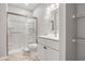 Modern bathroom with a walk-in shower and white vanity at 6117 E 113Th Ave, Temple Terrace, FL 33617