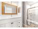 Modern bathroom with white vanity, quartz countertop, and a frameless glass shower at 6117 E 113Th Ave, Temple Terrace, FL 33617