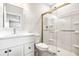 Modern bathroom with white vanity and frameless shower at 6117 E 113Th Ave, Temple Terrace, FL 33617