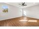 Spacious bedroom with hardwood floors and ceiling fan at 6117 E 113Th Ave, Temple Terrace, FL 33617