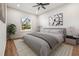 Bright bedroom with wood floors and neutral decor at 6117 E 113Th Ave, Temple Terrace, FL 33617