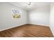 Spacious bedroom featuring wood-look floors and a window at 6117 E 113Th Ave, Temple Terrace, FL 33617
