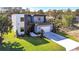 Two-story modern home with balcony and attached garage at 6117 E 113Th Ave, Temple Terrace, FL 33617