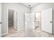 Bright hallway with marble-look floors and access to rooms at 6117 E 113Th Ave, Temple Terrace, FL 33617
