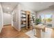 Home office with built-in shelving and access to balcony at 6117 E 113Th Ave, Temple Terrace, FL 33617