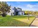 Modern two-story house with a grassy lawn at 6117 E 113Th Ave, Temple Terrace, FL 33617