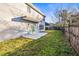 Two-story house with backyard patio and fence at 6117 E 113Th Ave, Temple Terrace, FL 33617
