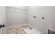 Laundry room with wire shelving and marble-look floors at 6117 E 113Th Ave, Temple Terrace, FL 33617