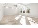 Bright and airy living room with marble-look floors and recessed lighting at 6117 E 113Th Ave, Temple Terrace, FL 33617