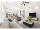 Open living room showcasing kitchen, staircase, and ample natural light at 6117 E 113Th Ave, Temple Terrace, FL 33617