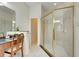 Bathroom with walk-in shower, vanity, and large mirror at 620 Mirabay Blvd, Apollo Beach, FL 33572