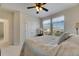 Bedroom with ceiling fan, neutral carpet, and large windows at 620 Mirabay Blvd, Apollo Beach, FL 33572