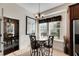 Bright breakfast nook with a round table and four chairs, adjacent to kitchen at 620 Mirabay Blvd, Apollo Beach, FL 33572