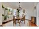 Bright dining room featuring a chandelier, hardwood floors, and views of the neighborhood at 620 Mirabay Blvd, Apollo Beach, FL 33572