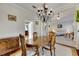 Spacious dining room with hardwood floors, chandelier and built-in hutch at 620 Mirabay Blvd, Apollo Beach, FL 33572