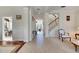 Inviting foyer featuring tile flooring, high ceilings, and access to the living room and dining room at 620 Mirabay Blvd, Apollo Beach, FL 33572