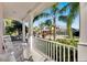Front porch with white columns and rocking chairs, overlooking the street at 620 Mirabay Blvd, Apollo Beach, FL 33572