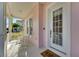 Bright and airy front porch with white columns and a view of the neighborhood at 620 Mirabay Blvd, Apollo Beach, FL 33572