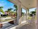 Relaxing front porch with white columns and rocking chairs, overlooking the street at 620 Mirabay Blvd, Apollo Beach, FL 33572
