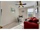 Home office features a comfortable red couch and workspace at 620 Mirabay Blvd, Apollo Beach, FL 33572