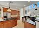 Modern kitchen with granite counters, stainless steel appliances, and wood cabinets at 620 Mirabay Blvd, Apollo Beach, FL 33572