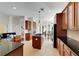 Updated kitchen with island, granite countertops, and stainless steel appliances at 620 Mirabay Blvd, Apollo Beach, FL 33572
