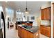 Eat-in kitchen with island, granite counters, and stainless steel appliances at 620 Mirabay Blvd, Apollo Beach, FL 33572