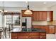 Updated kitchen with island, granite countertops and stainless steel appliances at 620 Mirabay Blvd, Apollo Beach, FL 33572