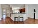 Modern kitchen with granite counters, wood cabinets, and breakfast bar at 620 Mirabay Blvd, Apollo Beach, FL 33572