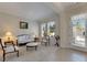 Bright living room with hardwood floors, neutral color palette, and elegant furniture at 620 Mirabay Blvd, Apollo Beach, FL 33572