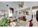 Bright living room with hardwood floors, white sofas, and a view of the kitchen at 620 Mirabay Blvd, Apollo Beach, FL 33572