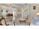 Open living space with hardwood floors, a view of the dining room and staircase at 620 Mirabay Blvd, Apollo Beach, FL 33572