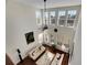 High-ceiling living room with hardwood floors and abundant natural light at 620 Mirabay Blvd, Apollo Beach, FL 33572
