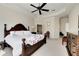 Spacious main bedroom featuring a ceiling fan and access to the ensuite bathroom at 620 Mirabay Blvd, Apollo Beach, FL 33572