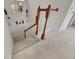 Elegant staircase with wood railing and neutral carpeting at 620 Mirabay Blvd, Apollo Beach, FL 33572