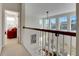Bright upper hallway overlooking the main living area with natural light and open feel at 620 Mirabay Blvd, Apollo Beach, FL 33572