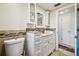 Bathroom with double sink vanity and medicine cabinets at 7741 Tropicana Dr, Port Richey, FL 34668