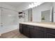 Clean bathroom with dark vanity and a shower/tub at 807 Garden Oaks Sq, Seffner, FL 33584