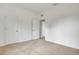 Simple bedroom with carpeted floor and two closets at 807 Garden Oaks Sq, Seffner, FL 33584