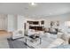 Open-concept living room and kitchen with modern decor and plenty of natural light at 807 Garden Oaks Sq, Seffner, FL 33584